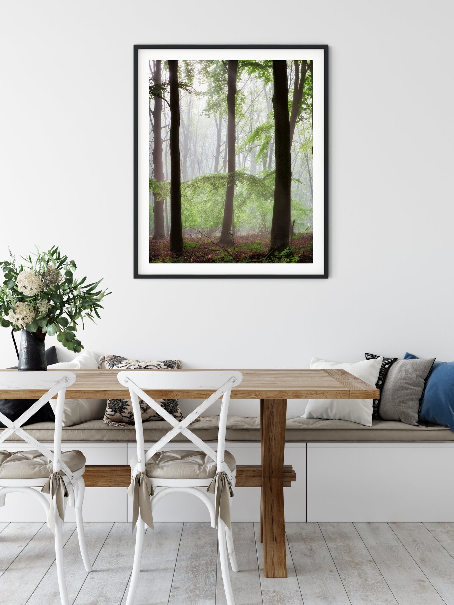 framed print of trees in a forest in a breakfast room